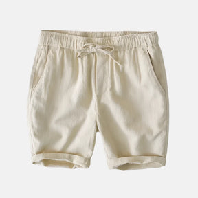 Short bege de cintura elástica com cordão ajustável e bolsos laterais. Design casual e confortável, ideal para o dia a dia ou atividades leves.