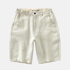 Short Pure Comodoro em linho bege claro, com cintura ajustável, bolsos laterais e traseiros. Design sofisticado, ideal para looks casuais ou sociais em dias quentes.